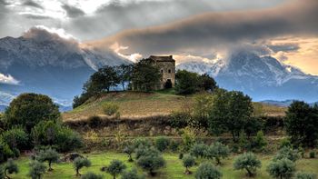 House On The Hill With Mountains screenshot