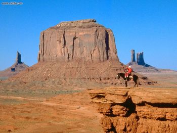 Navajo On Horseback Monument Valley Arizona screenshot